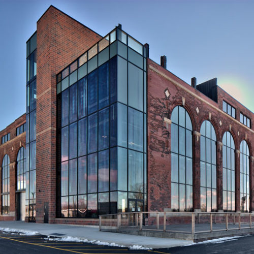 Exterior of The Powerhouse with sky reflected in windows